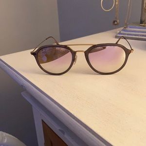 Pink Ray Ban aviators.